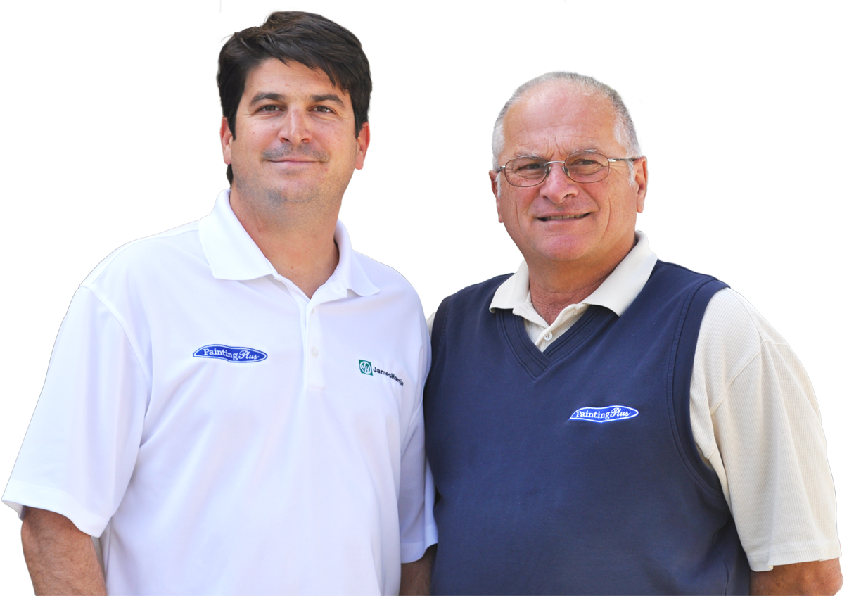 Two men wearing company logo shirts, specializing in Siding Installations & Repairs, posing for a photograph.